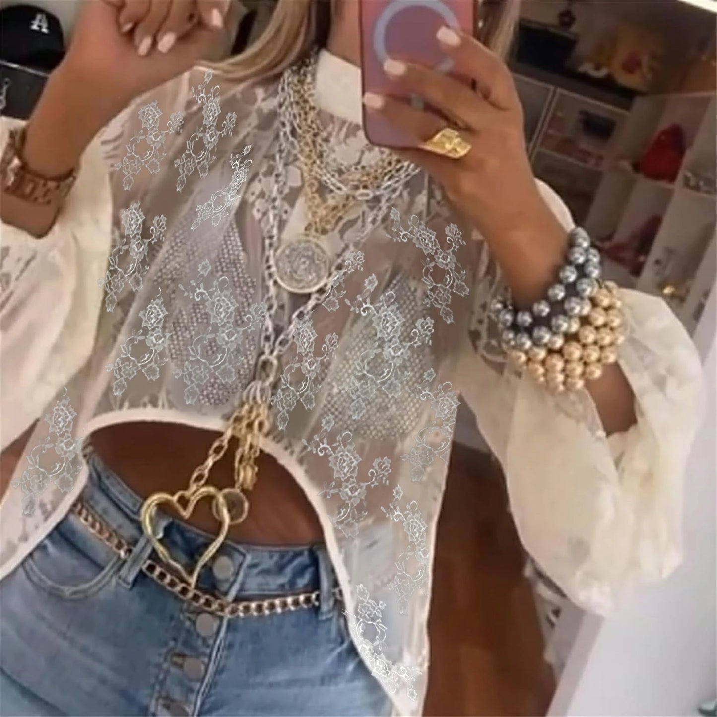 Women's long-sleeved blouse with lace details and a long back